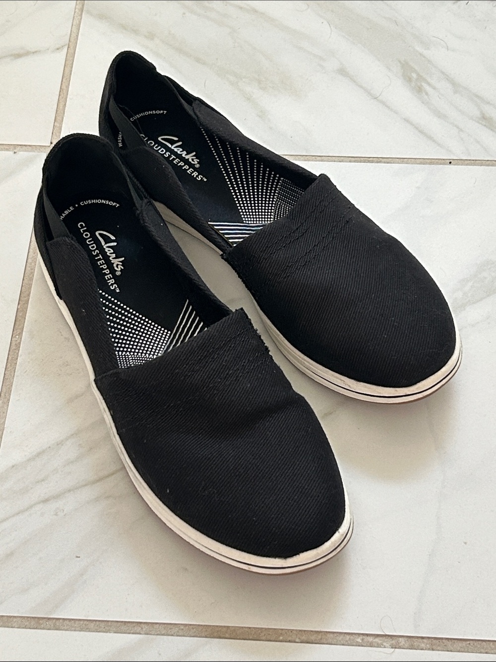 Clarks Black Canvas Slip-On Flats with White Trim